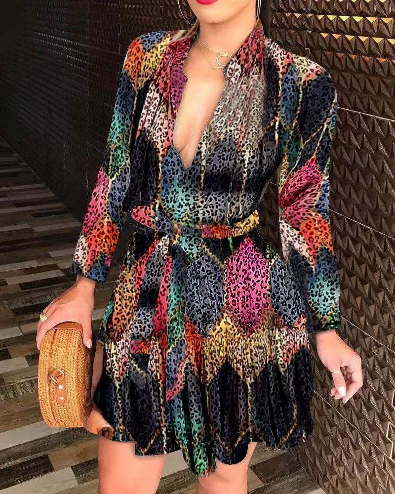 Showlu Fashion women's floral print V-neck long sleeve A-line mini dress with lace-up detail and sexy design.