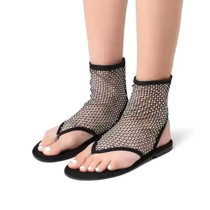 Women's hollow mesh flat sandals with round toes, rhinestone accents, and a sleek flat sole, stylishly designed by Showlu Fashion.