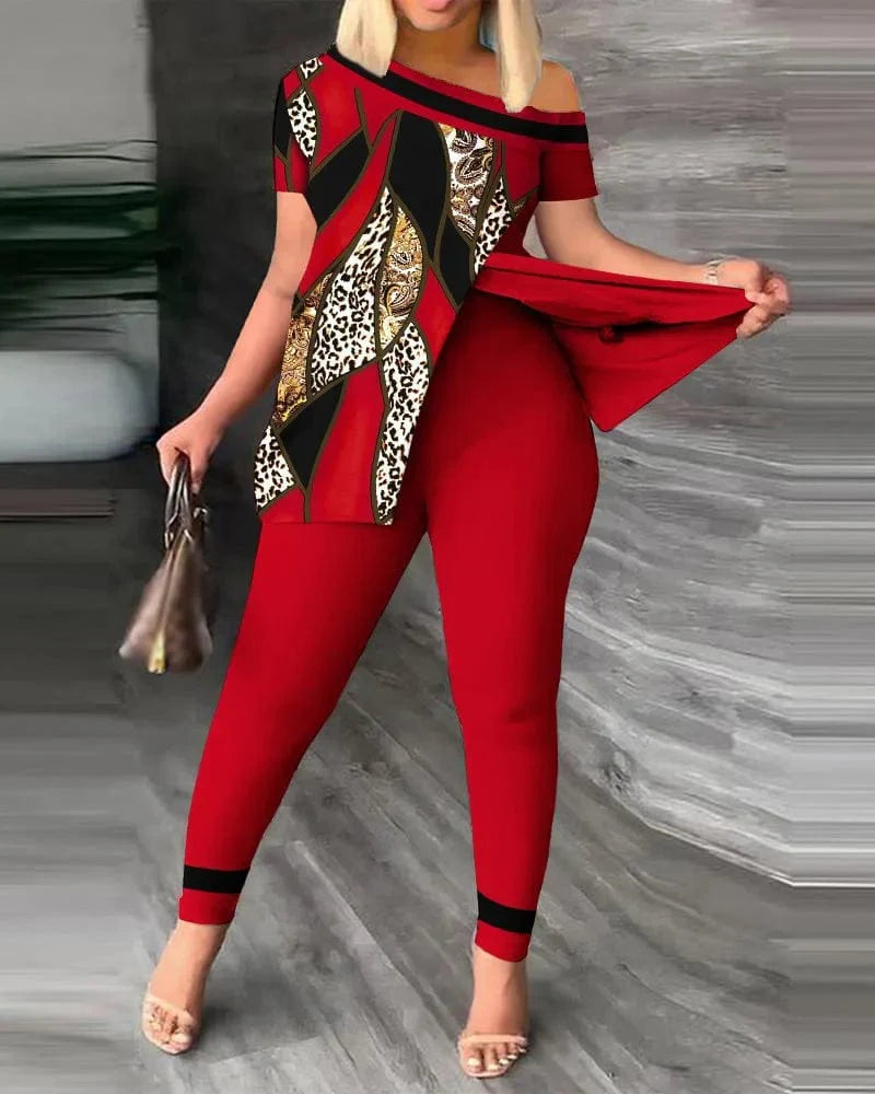 Women's printed two-piece set from SHOWLU FASHION STORE featuring a skew collar top and pencil pants with slit and irregular design.