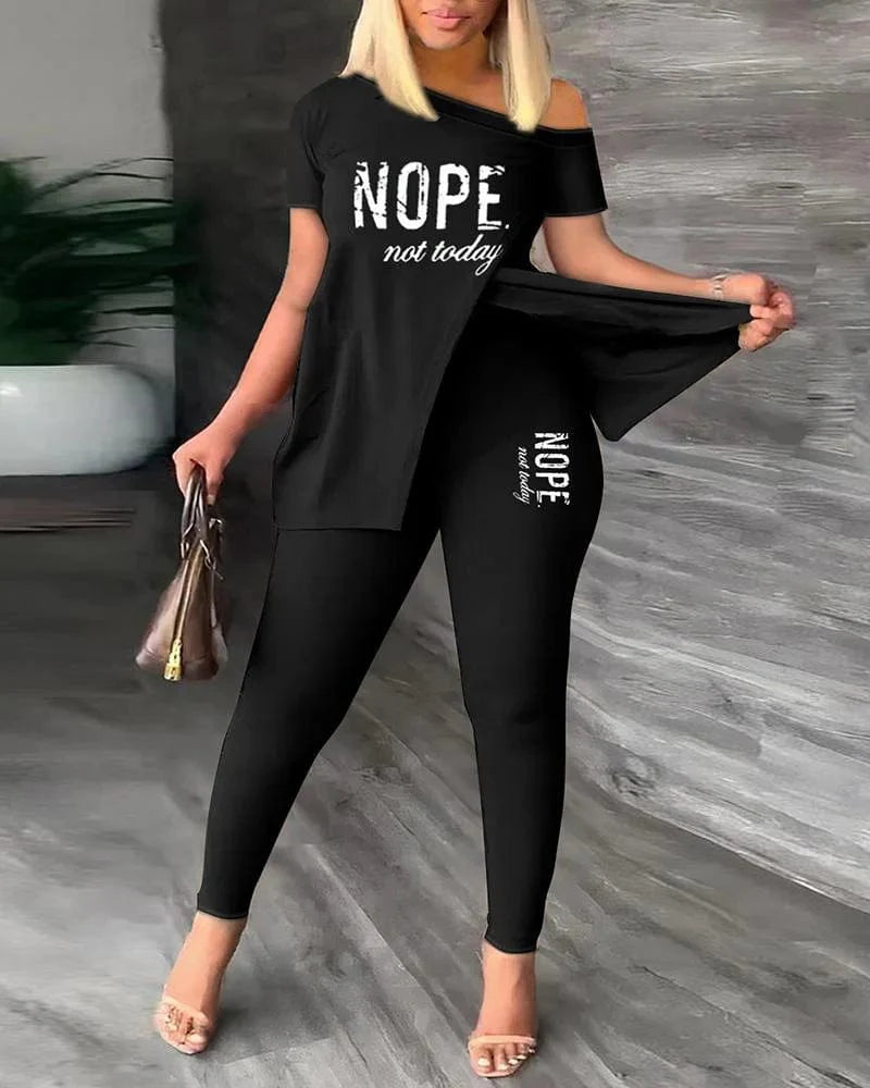 Women's printed two-piece set with skew collar top and pencil pants, featuring slit detail and a stylish, modern design.