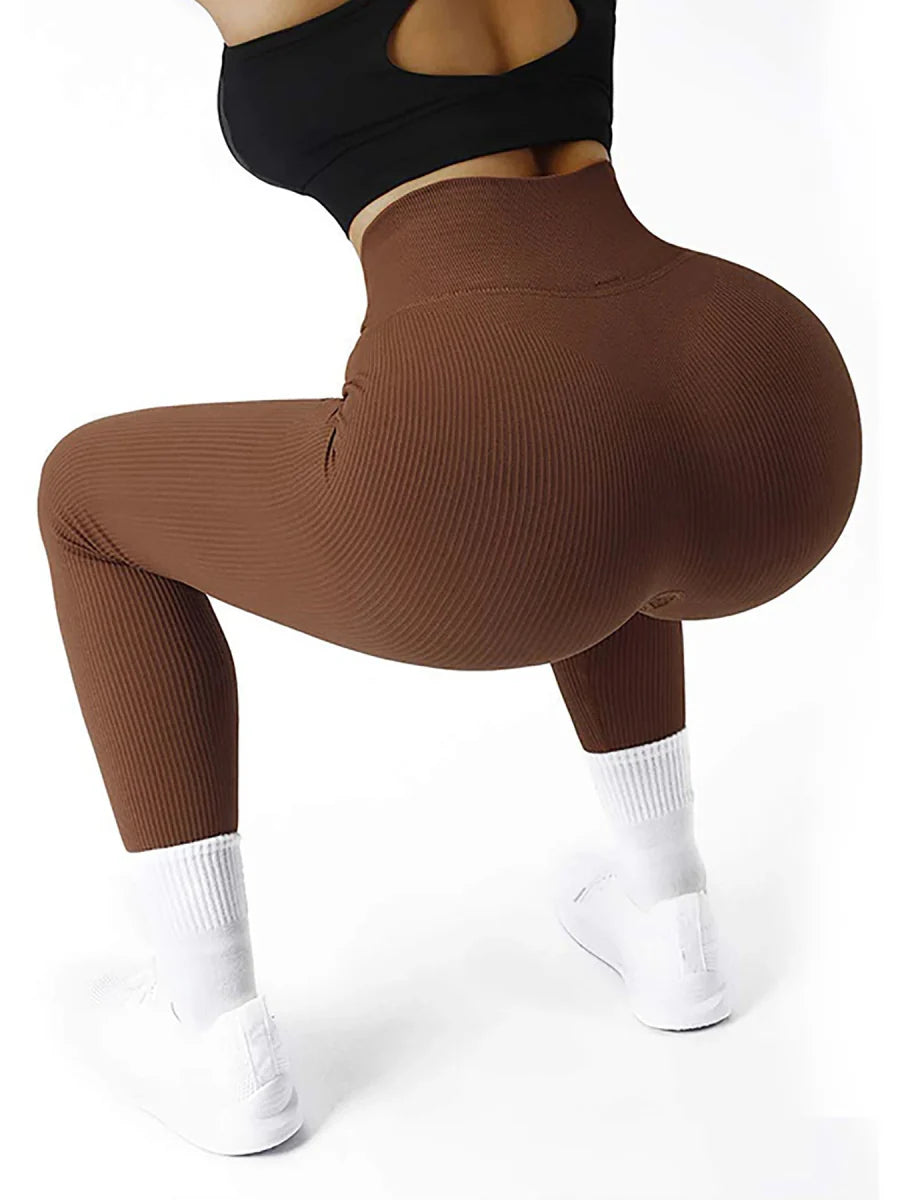 Women's high waist ribbed yoga cycling leggings in solid color, seamless and suitable for fitness and daily wear.