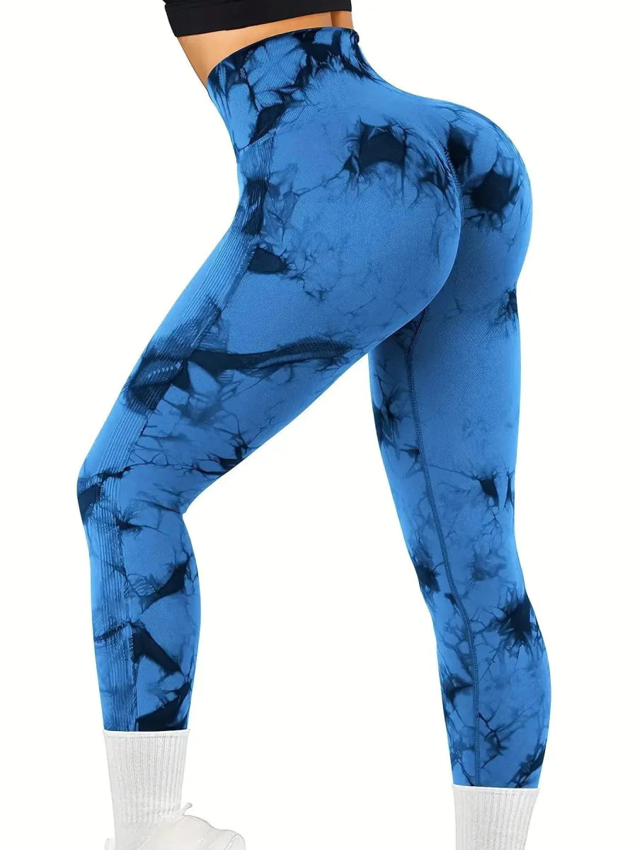 Showlu Women's tie-dye seamless high waist yoga pants in peach, featuring stretch nylon fabric and a comfortable fit for fitness or yoga.