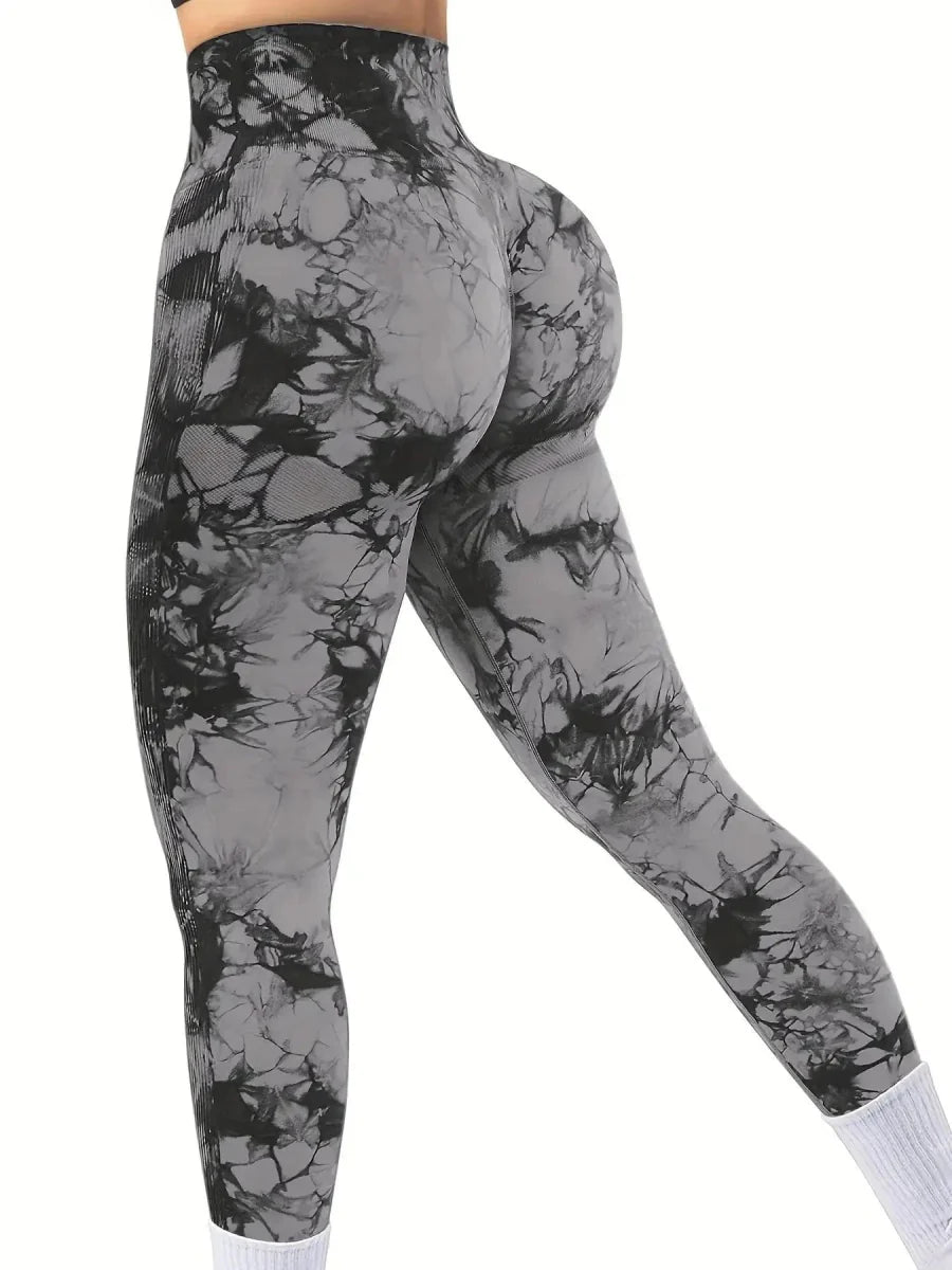 Showlu Women's peach tie-dye seamless high waist yoga pants with stretch nylon fabric for fitness and comfortable movement.
