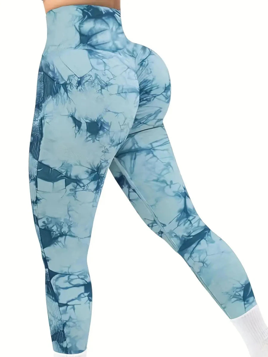 Showlu Women's tie-dye seamless high-waist yoga pants in peach, featuring stretch fabric and a flattering fit for fitness and yoga.