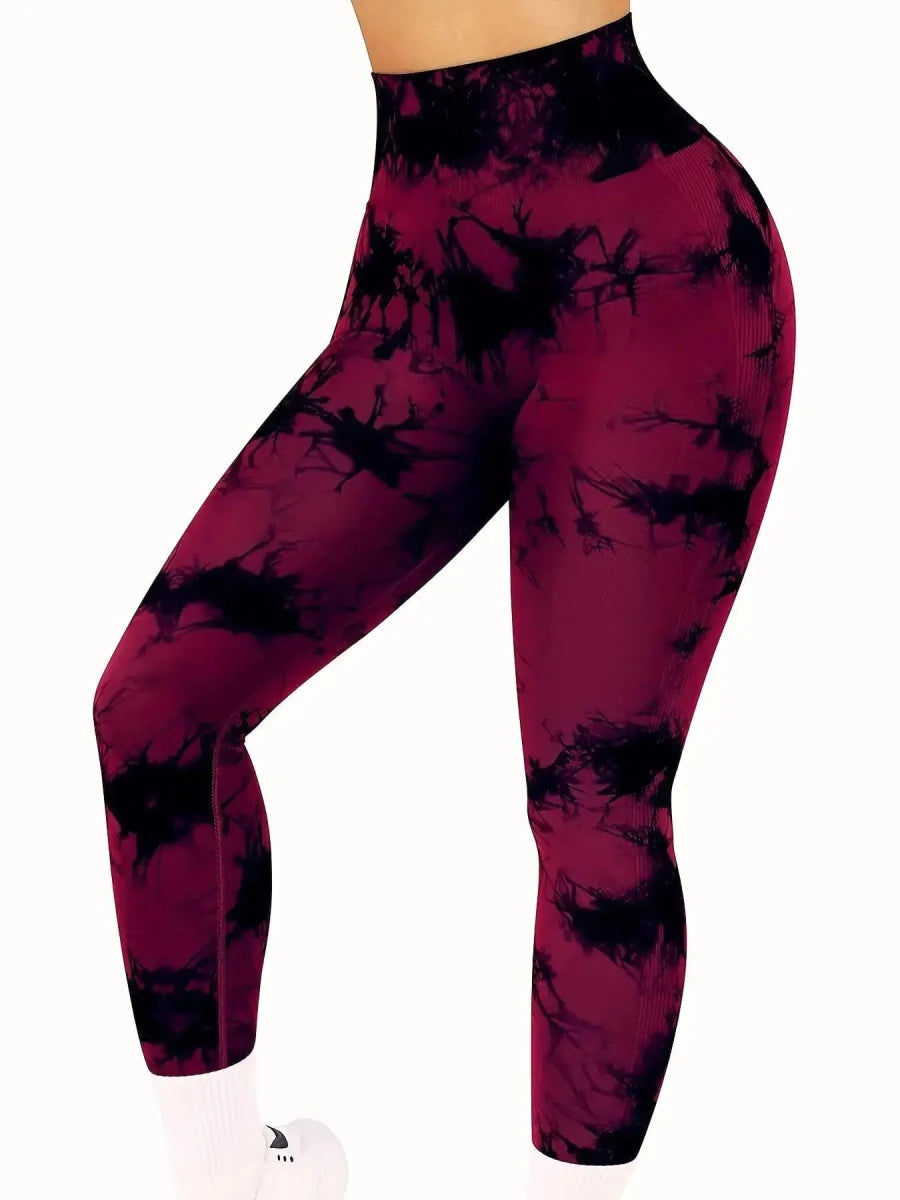 Showlu women's tie-dye seamless high-waist yoga pants in peach with a fitted, stretchy nylon fabric for fitness and yoga activities.
