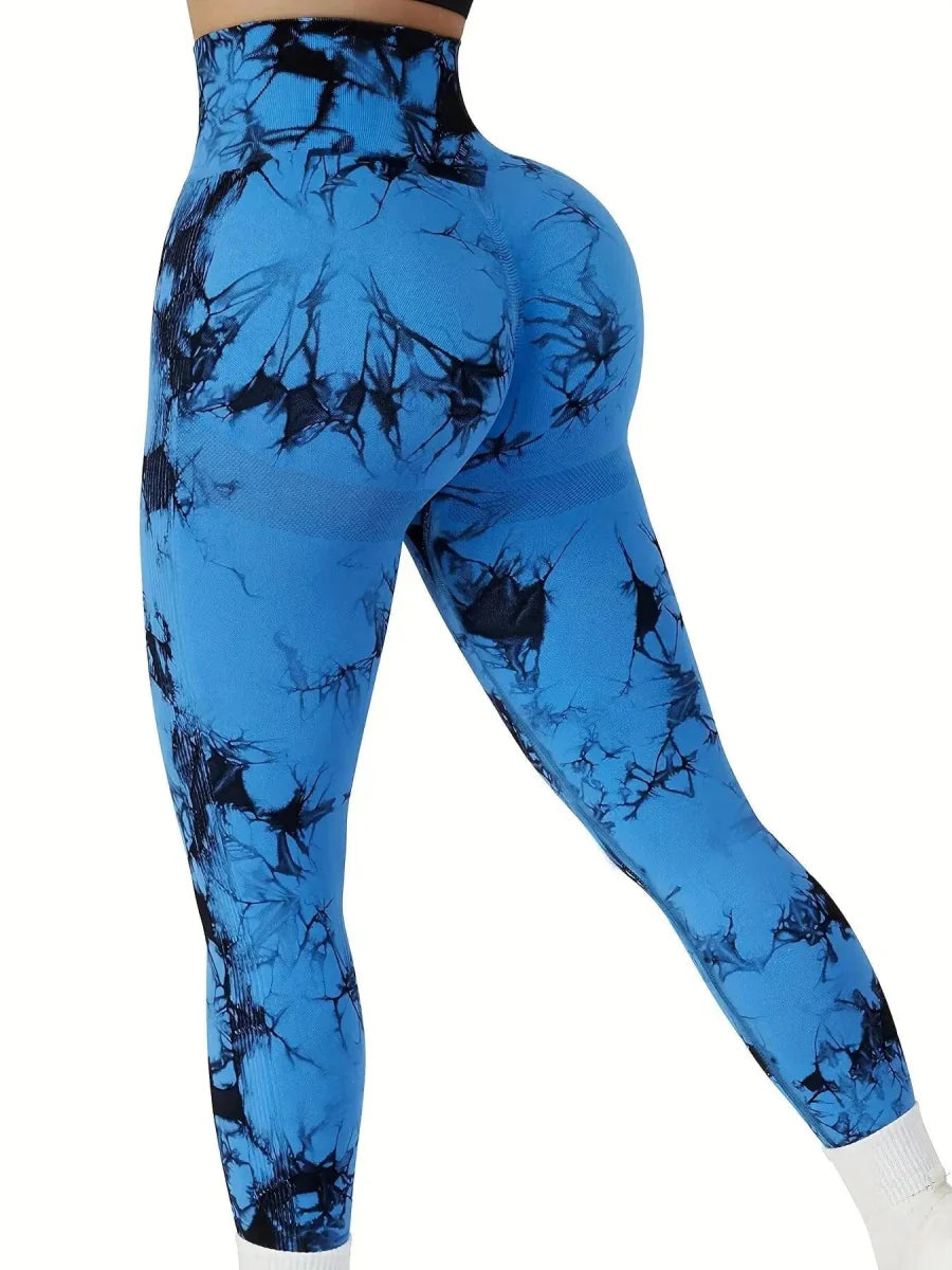 Showlu Women's tie-dye seamless high-waist yoga leggings in peach, featuring a stretch fit and sculpted butt design.