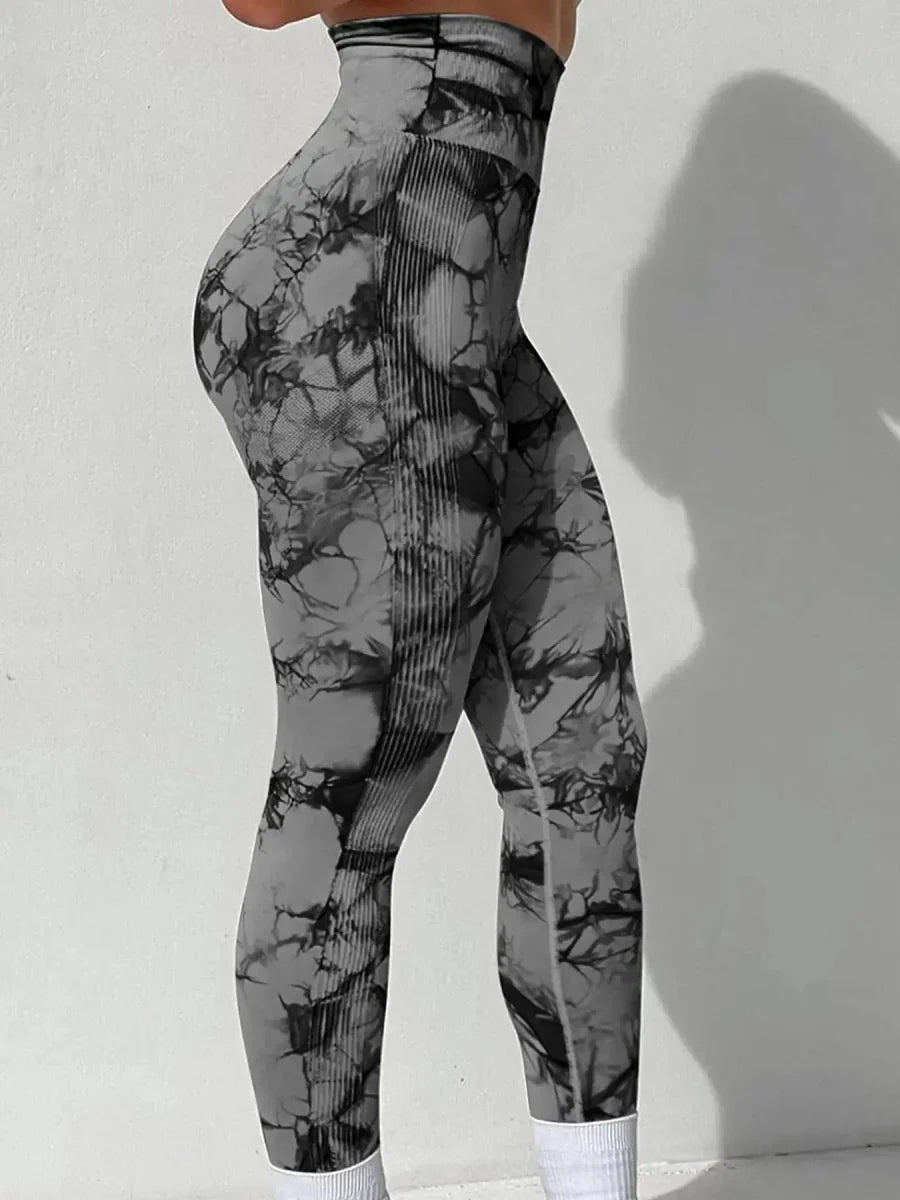 Showlu Women's tie-dye seamless high waist yoga pants in peach, stretchy nylon leggings for fitness and yoga.
