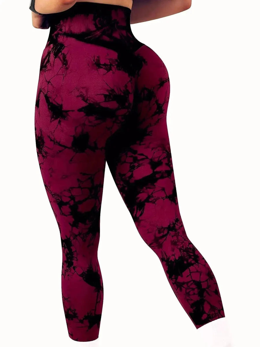 Showlu Women's peach tie-dye seamless high-waist yoga pants with stretch fit, designed for comfort and flexibility during fitness activities.
