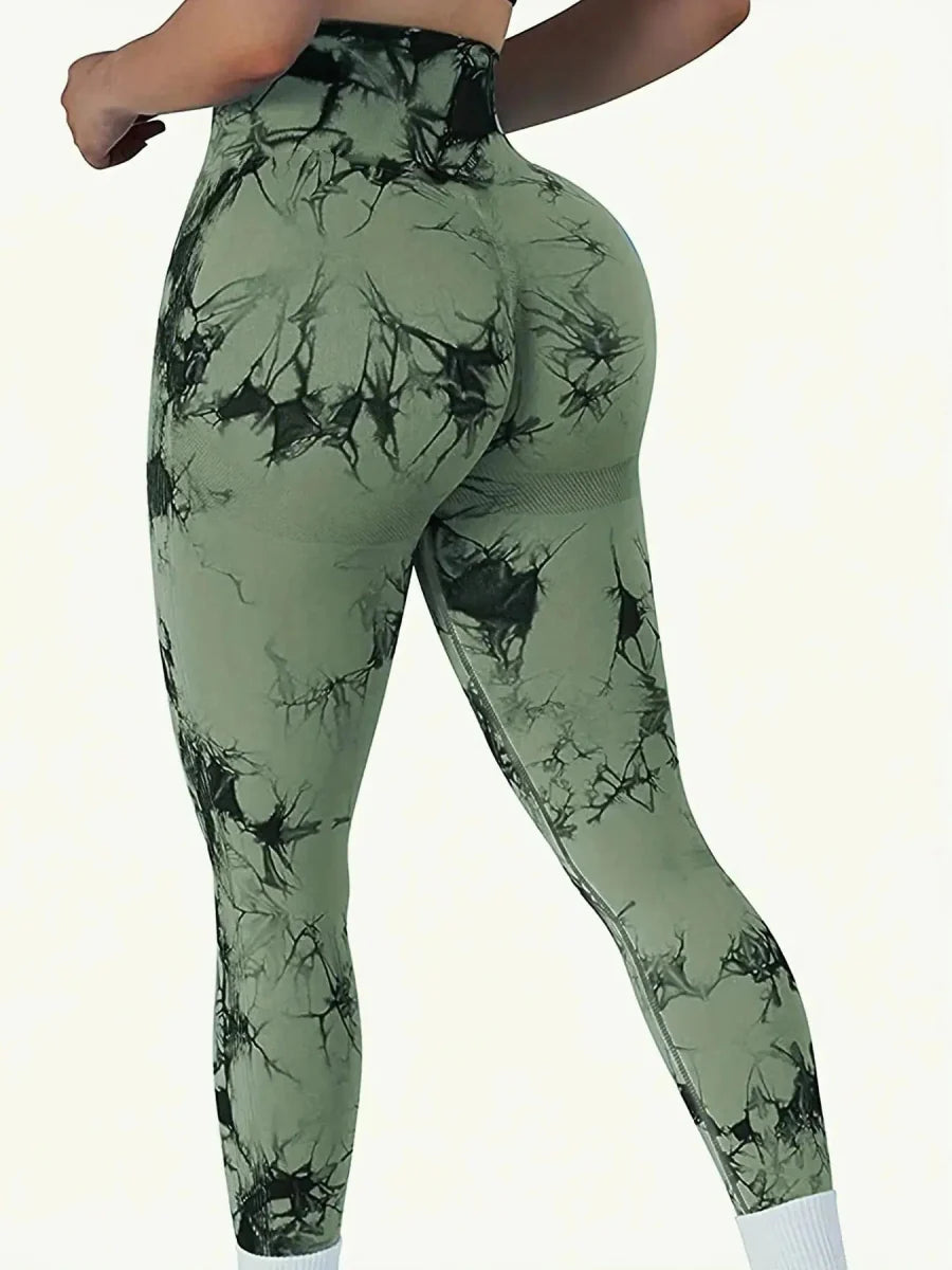 Showlu Women's peach tie-dye seamless high-waist yoga leggings with stretch nylon for fitness and comfortable movement.