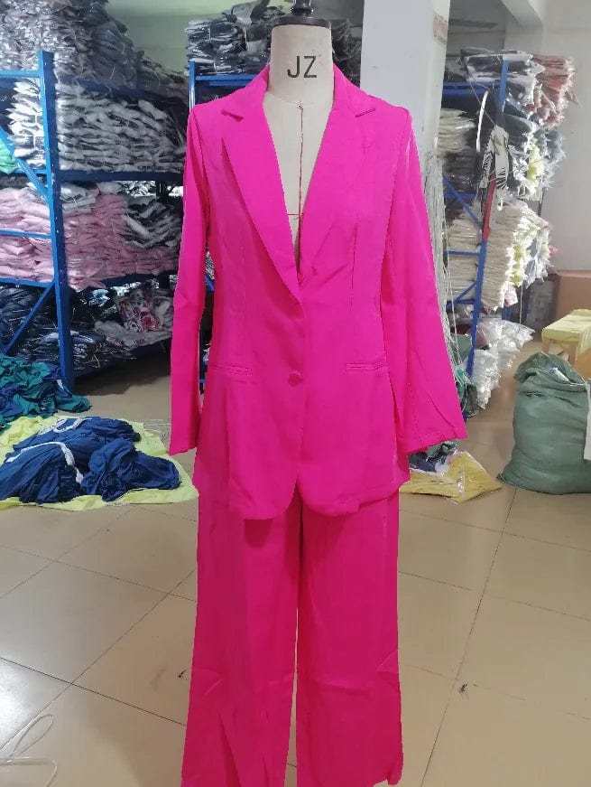 Elegant women's blazer and matching pants set with notched collar, long sleeves, and button details, perfect for spring and summer.