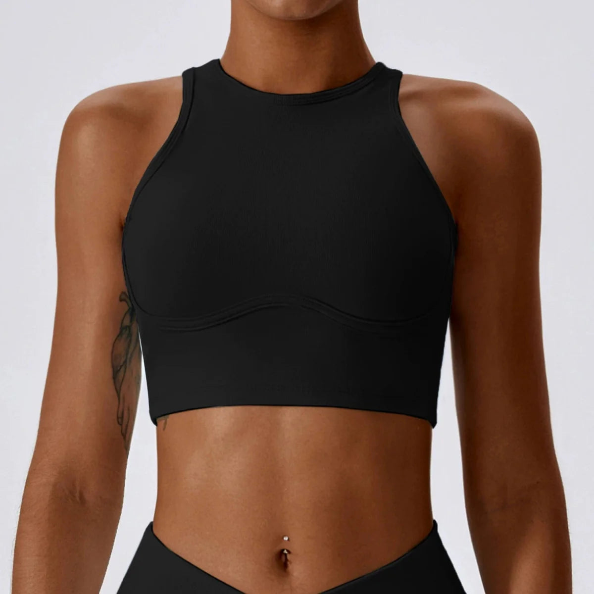 Showlu Fashion hollow-out nylon yoga sports vest with chest pad, featuring a tight fit and stylish design for activewear.