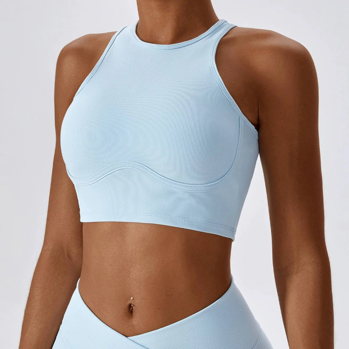 Showlu Fashion hollow-out nylon yoga sports vest with chest pad, designed for flexibility and support during workouts.