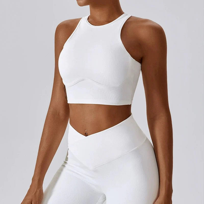 Showlu Fashion hollow-out nylon yoga sports vest with built-in chest pad, designed for comfort and support during exercise.