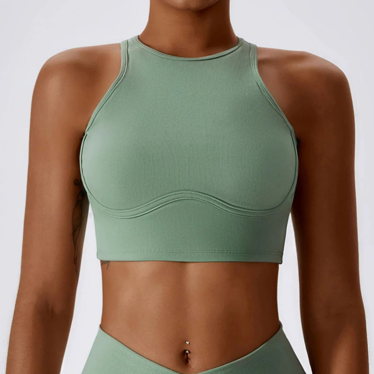 Showlu Fashion hollow-out nylon yoga sports vest with chest pad, tight fit, designed for comfortable active wear.
